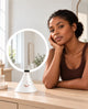 FUNTOUCH RM321 white LED vanity mirror on a dressing table beside a woman.
