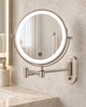 Satin nickel round LED makeup mirror with an articulated wall-mounted arm in a cream bathroom.