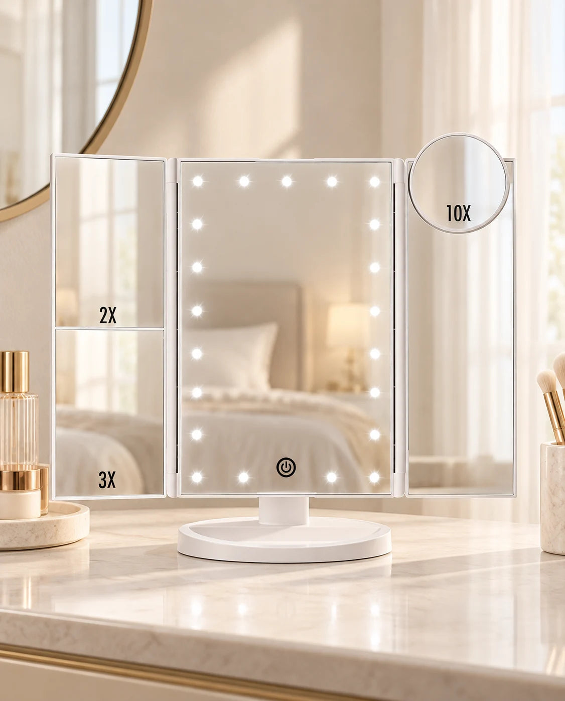 White tri-fold LED makeup mirror with 2x and 3x side panels and a round 10x magnifier on a cream vanity.